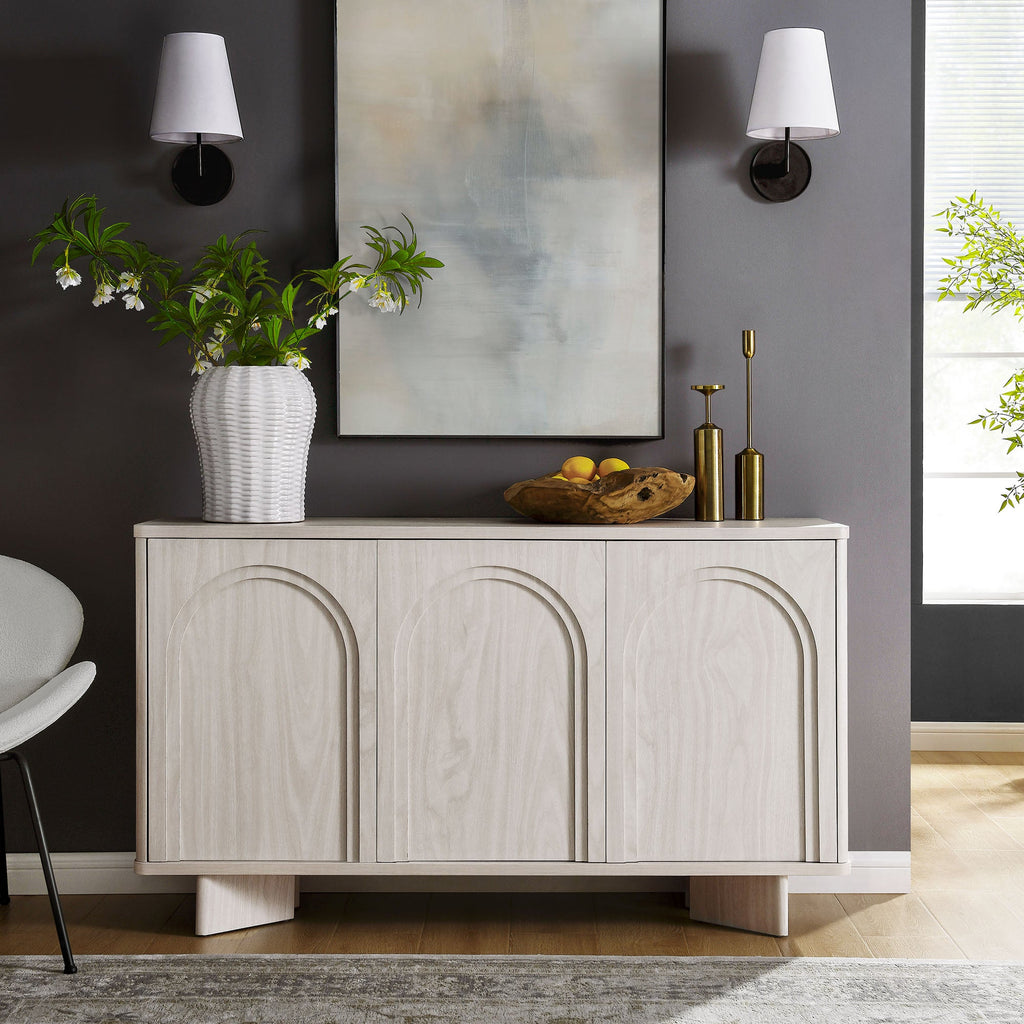 Arched 3-door sideboard storage cabinet with white wash finish and arched door fronts.