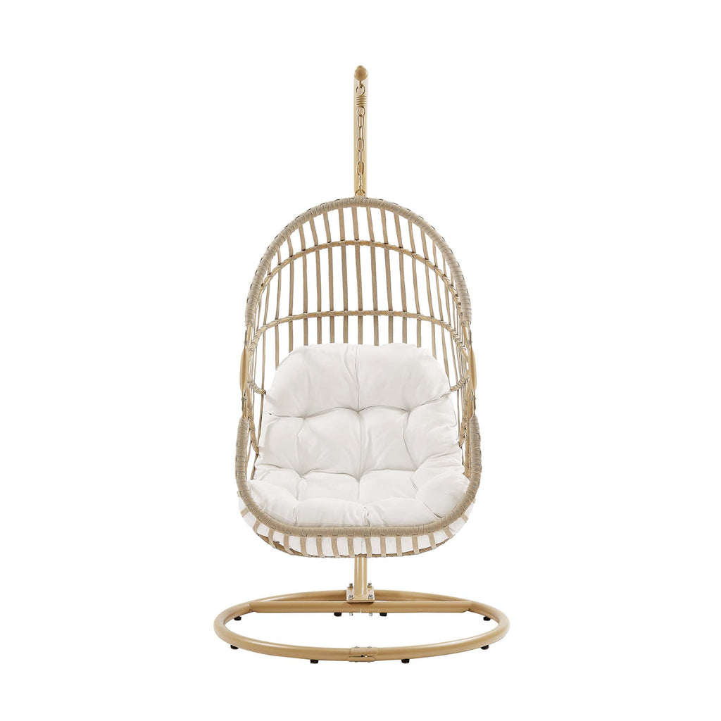 Outdoor hanging wicker swing chair with white padded cushion and hanging chain.