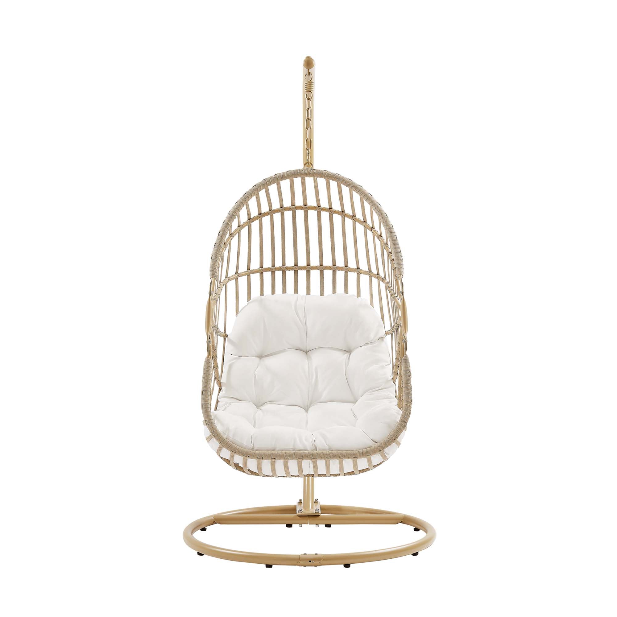 Outdoor hanging wicker swing chair with white padded cushion and hanging chain.