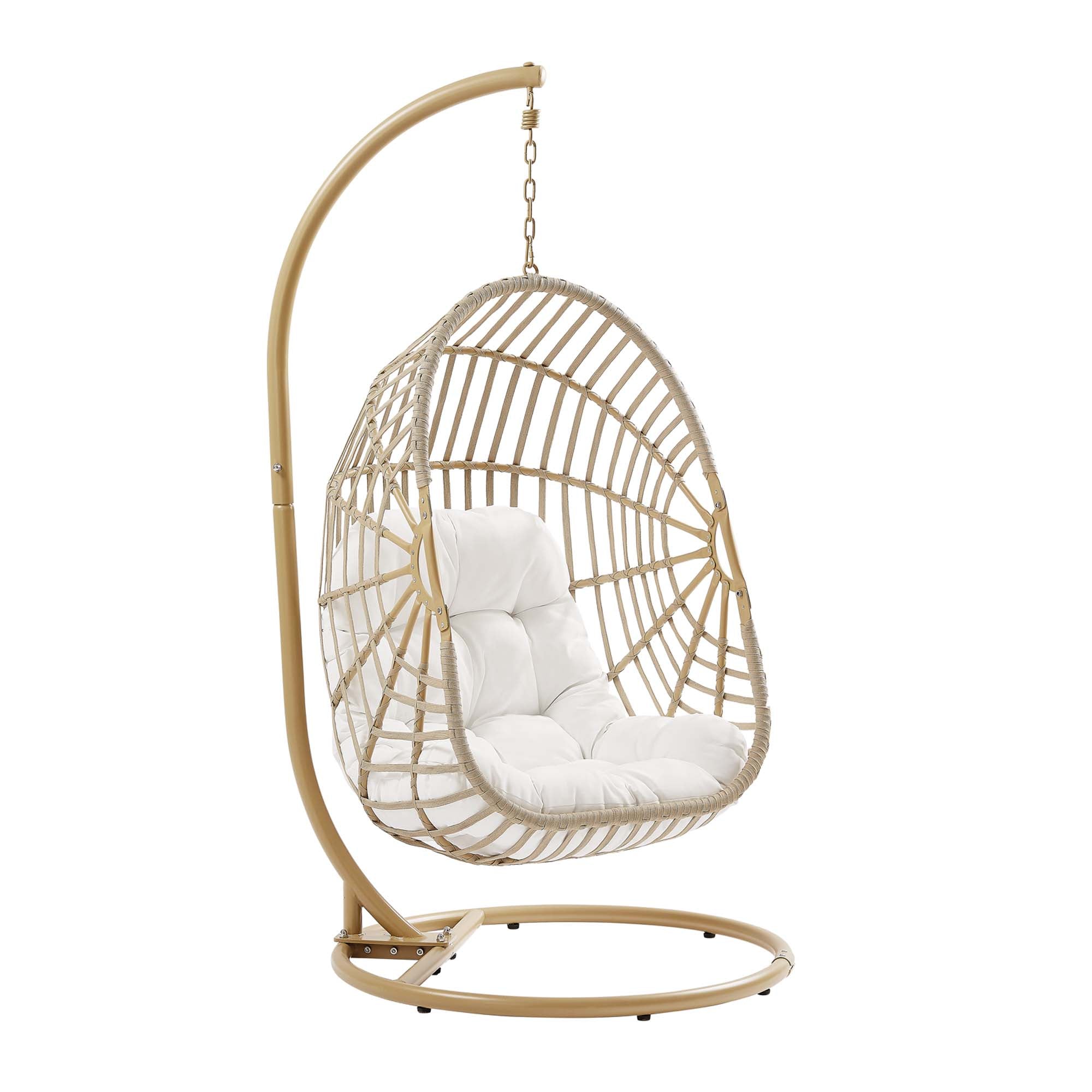 Outdoor hanging wicker swing chair with white cushion; arched rattan frame and chain.