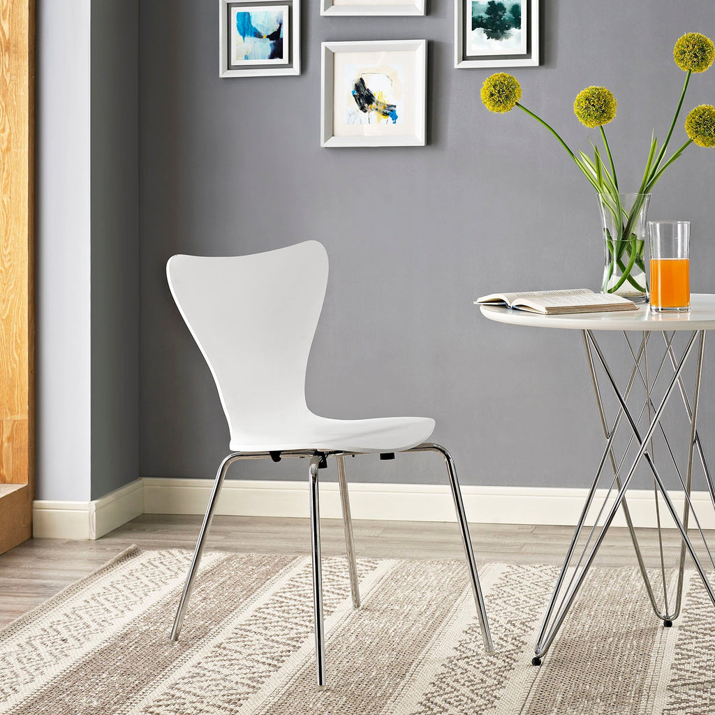 White dining side chair with curved back, molded seat, and chrome metal legs