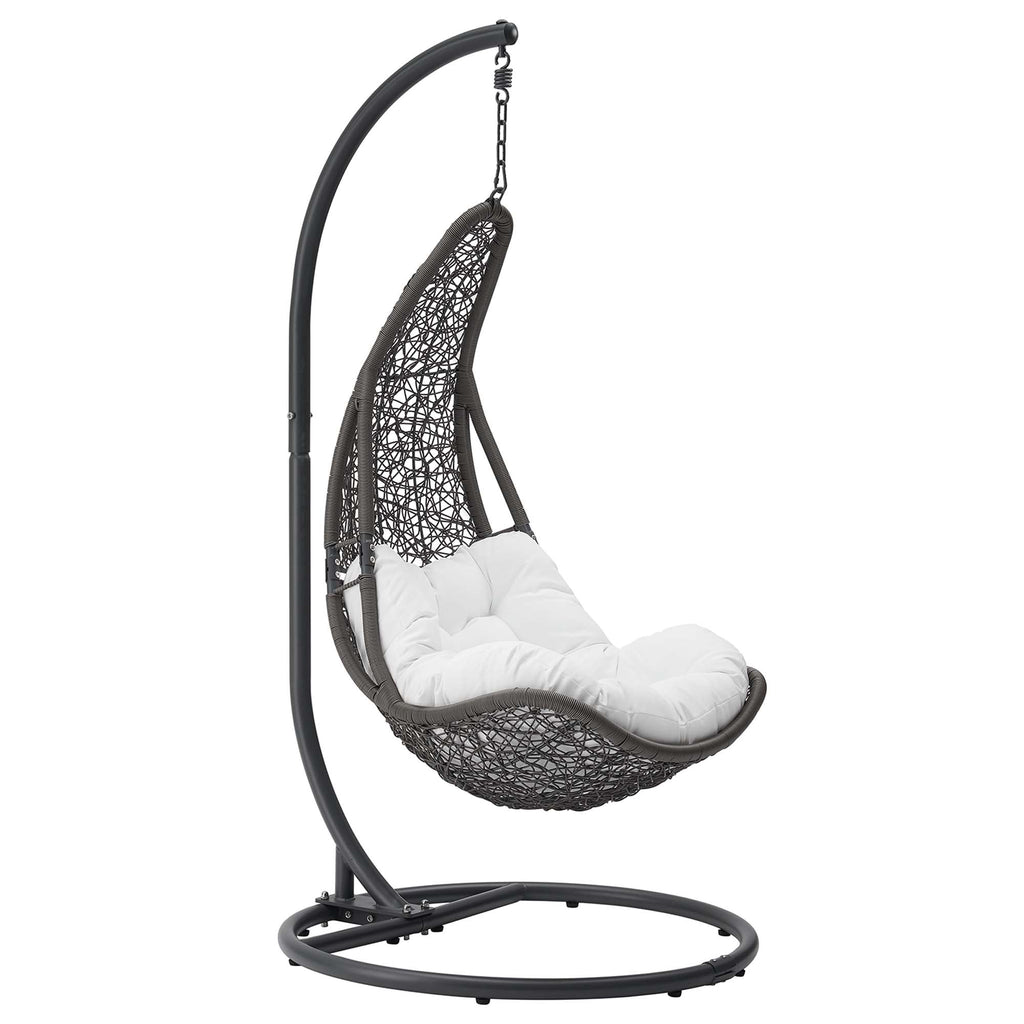 Hanging patio swing chair with gray curved stand and black woven seat with white cushion