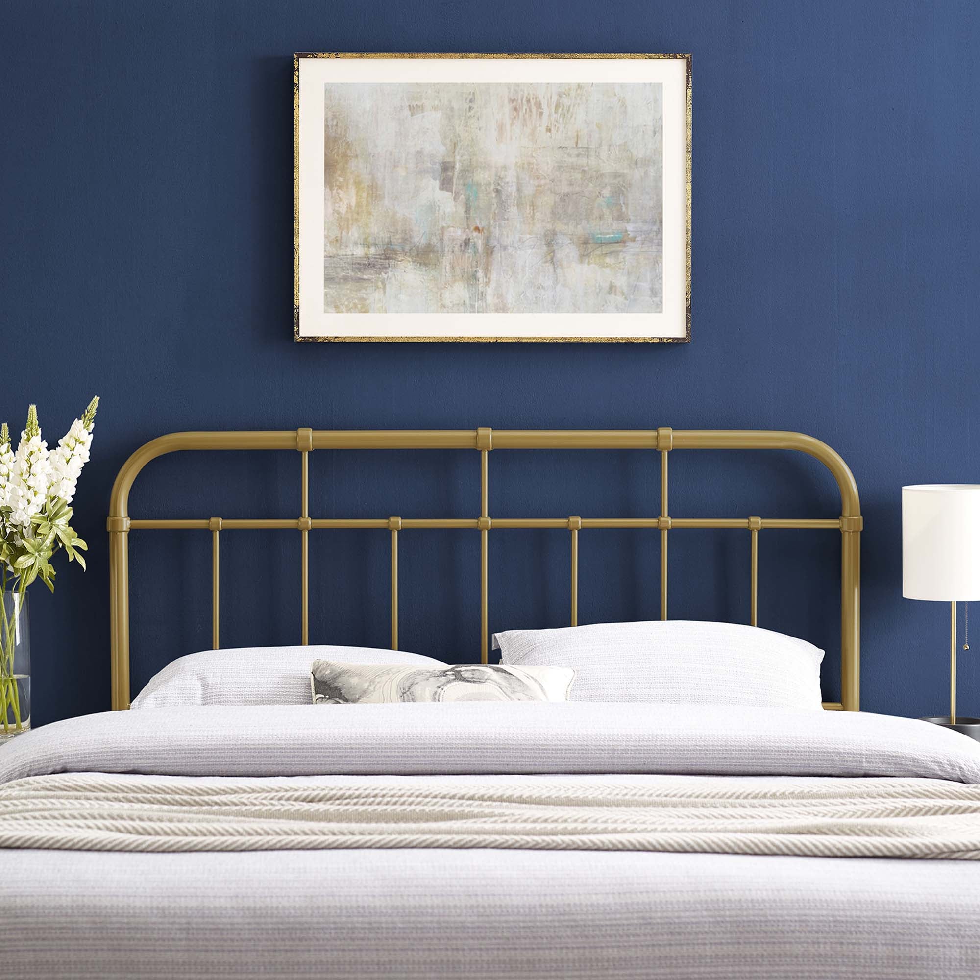 Metal headboard with vertical bars and rounded top rail, gold finish