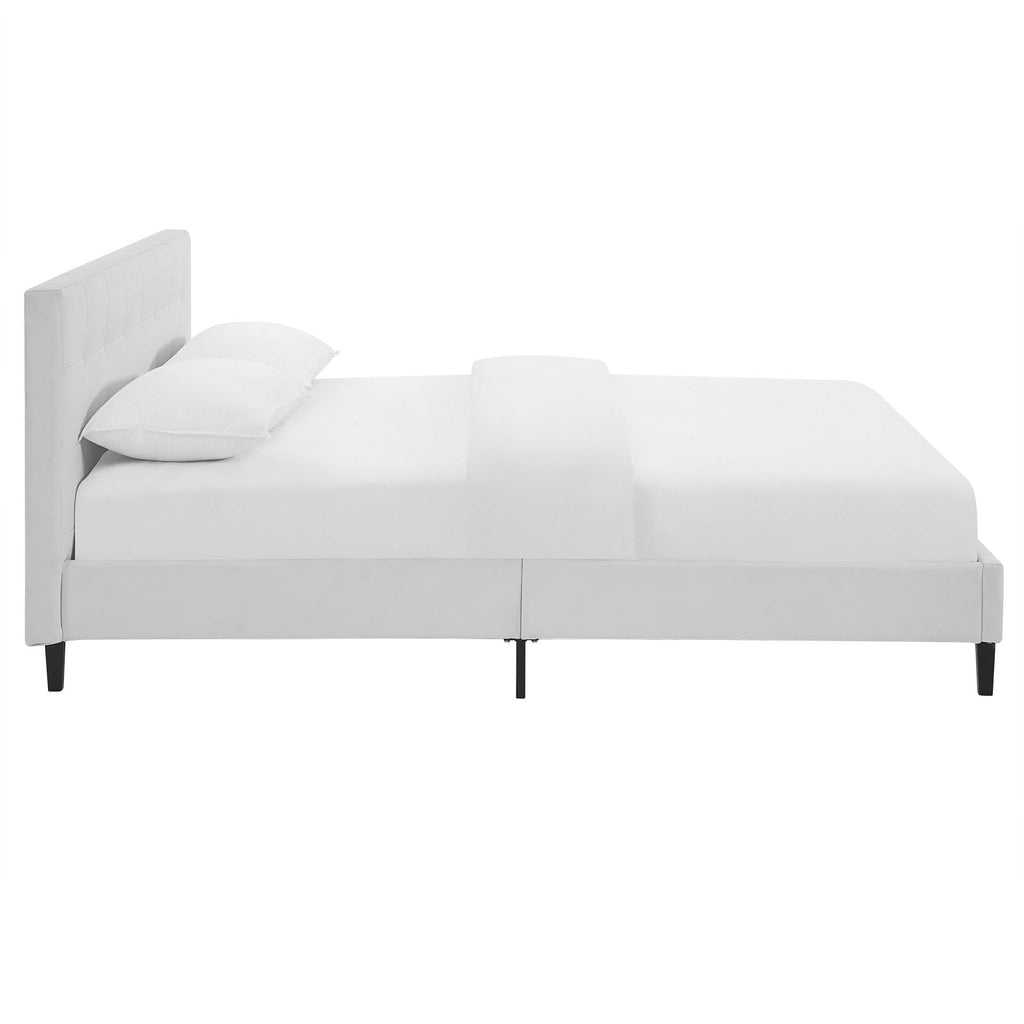 White upholstered platform bed frame with padded headboard and side panels