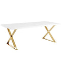 Rectangular dining table with glossy white top and gold X-frame base