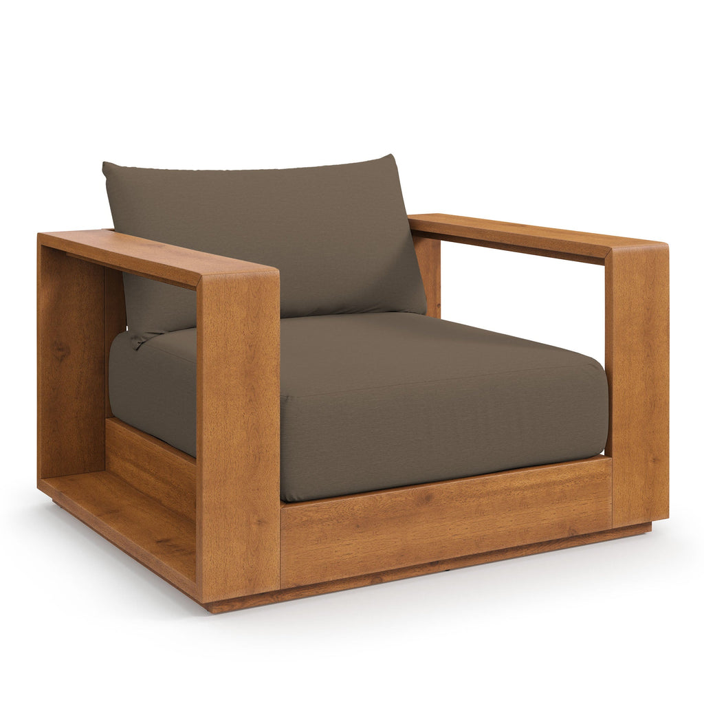 Outdoor patio acacia lounge chair with dark cocoa cushions, armrests and open side panel