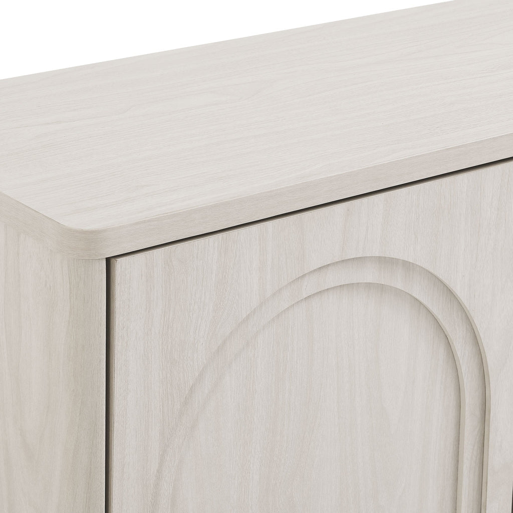 Arched door detail on a white wash arched 3-door sideboard storage cabinet with smooth panel molding.