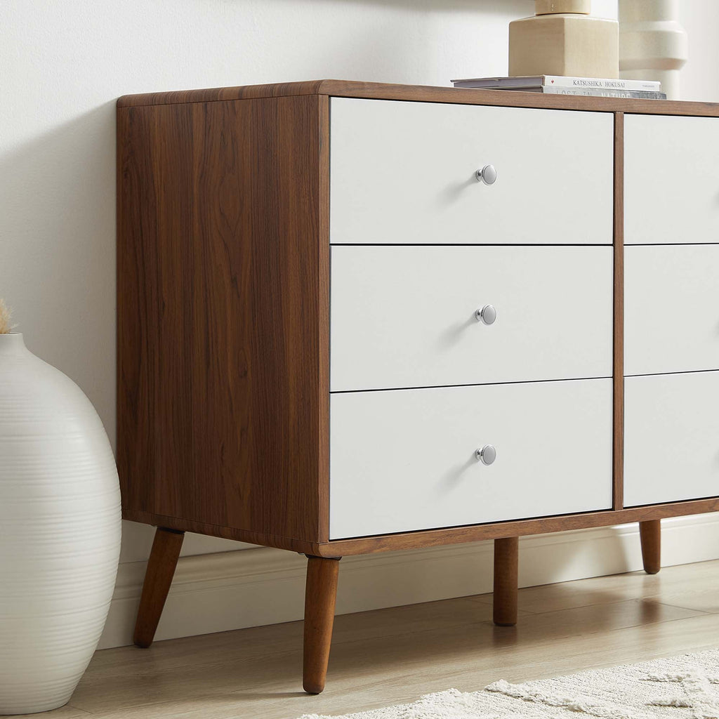 Walnut and white mid-century dresser with three visible drawers and tapered legs