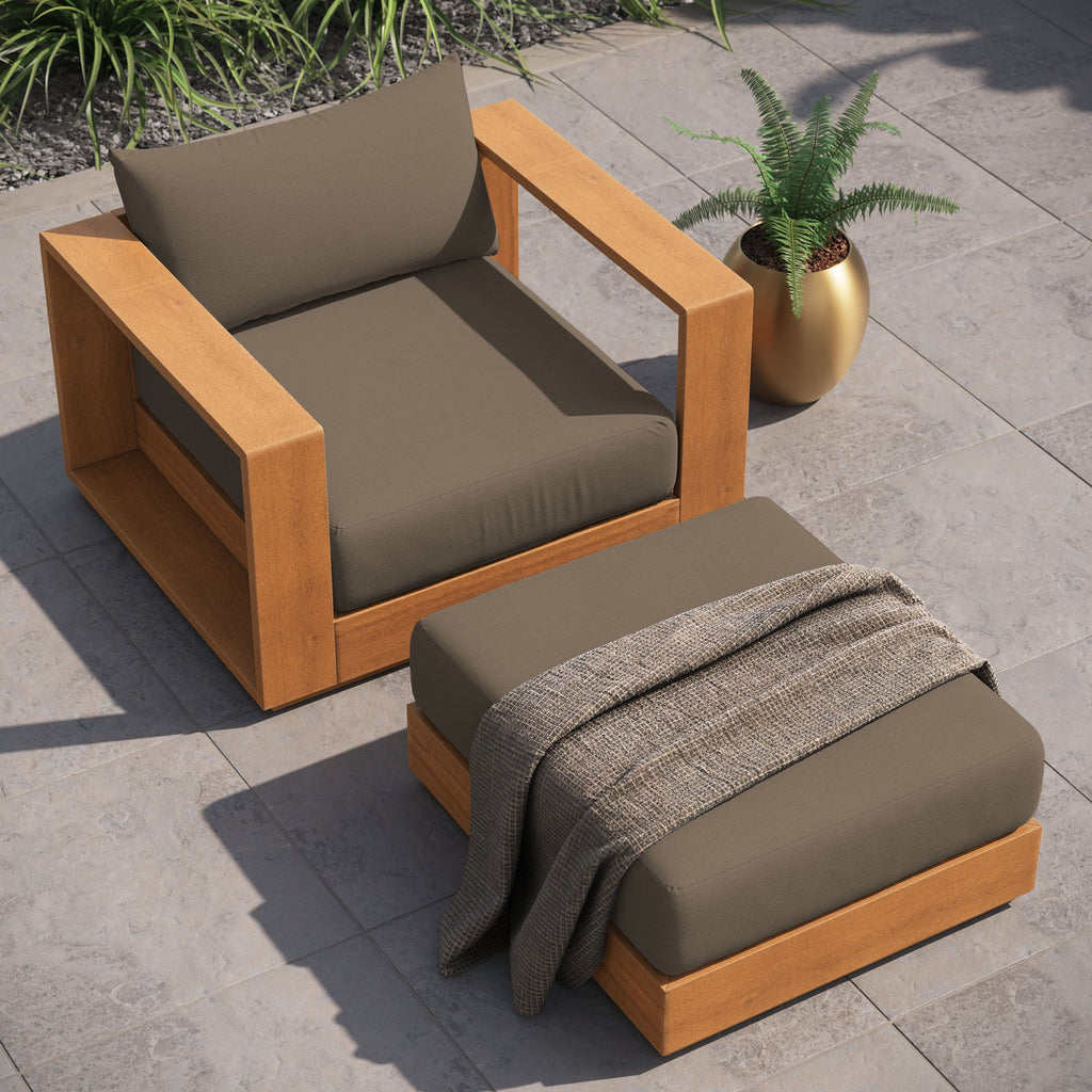 Acacia wood outdoor armchair and ottoman set with dark cushions