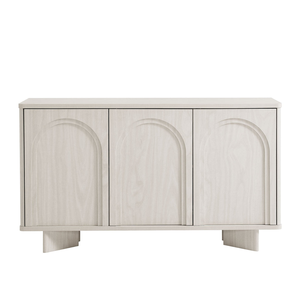 Arched 3-door sideboard storage cabinet in white wash with three arched door fronts on a low base.