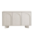 Arched 3-door sideboard storage cabinet in white wash with three arched door fronts on a low base.