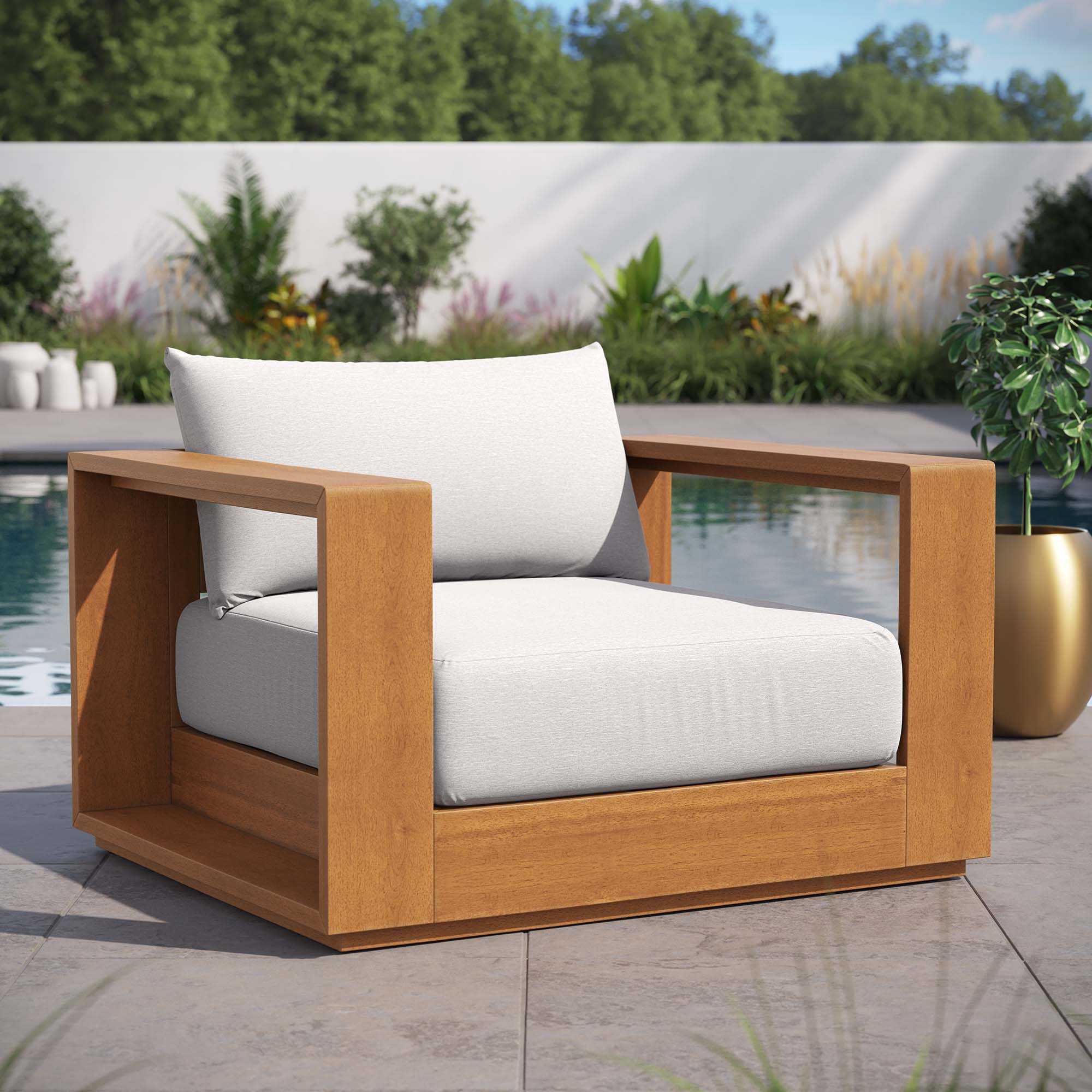 Outdoor patio acacia lounge chair with light gray cushions and arm frame