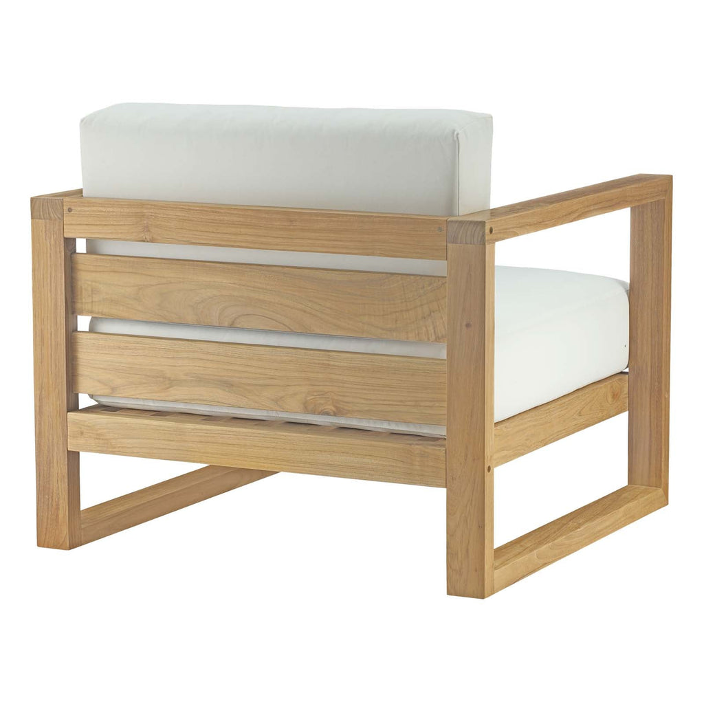 Outdoor patio teak armchair with white cushions and slatted sides, light wood frame