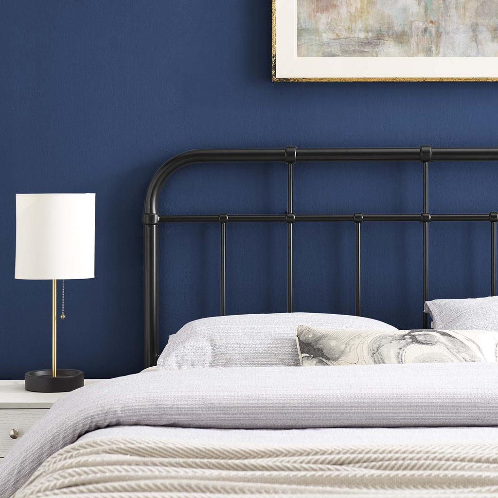 Metal headboard with vertical bars and rounded top rail in dark finish