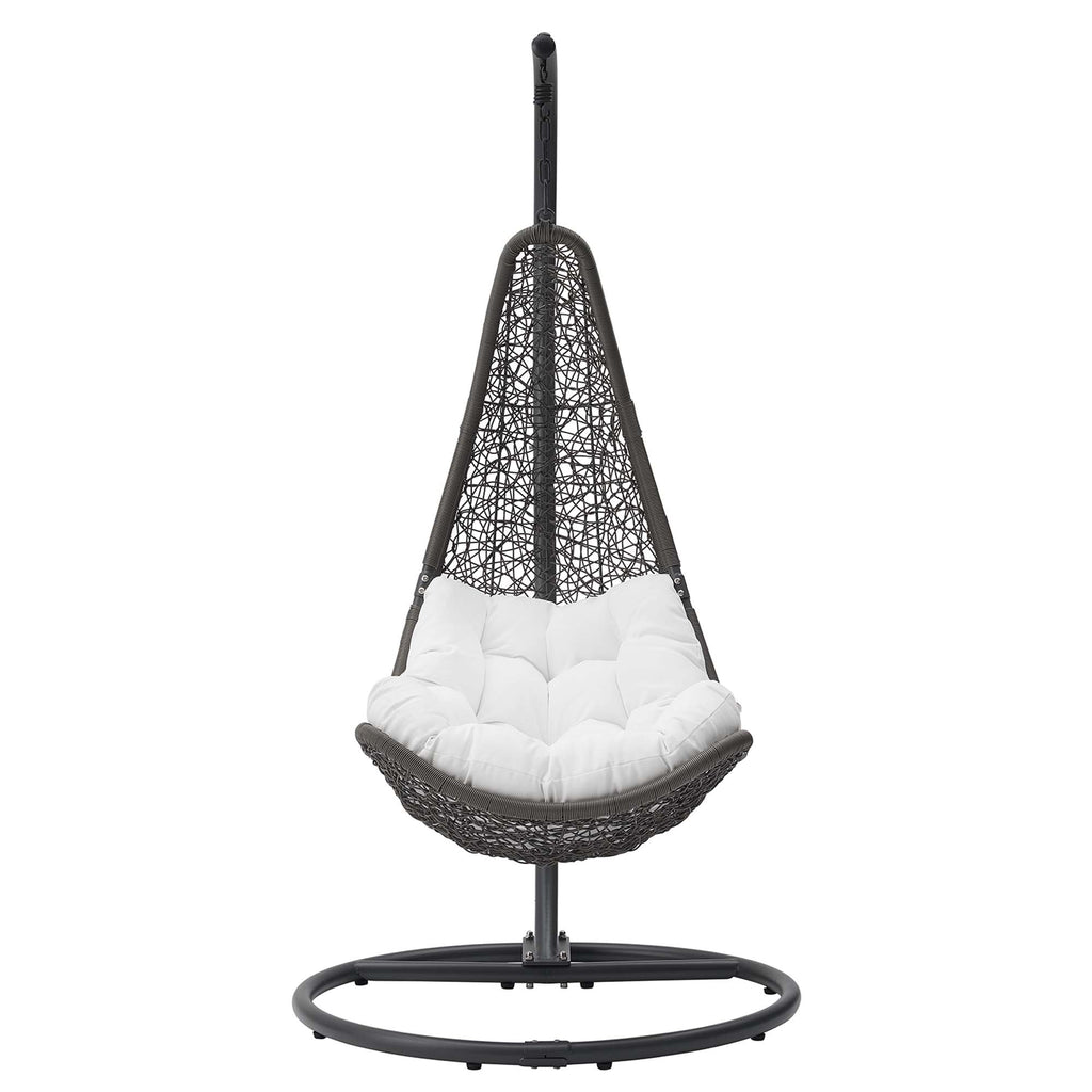 Hanging patio swing chair with black woven hanging pod, white padded seat, and round base