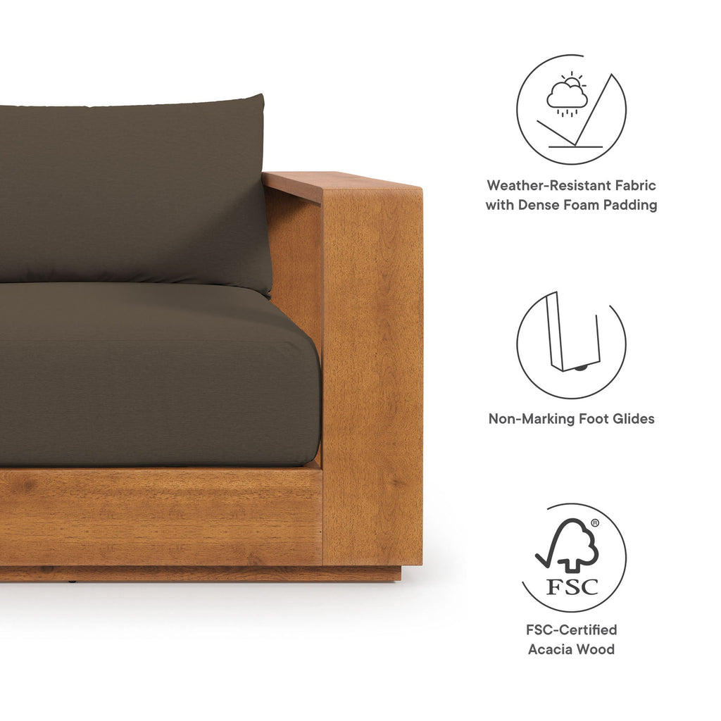 Acacia wood outdoor armchair with dark cushion and armrest detail
