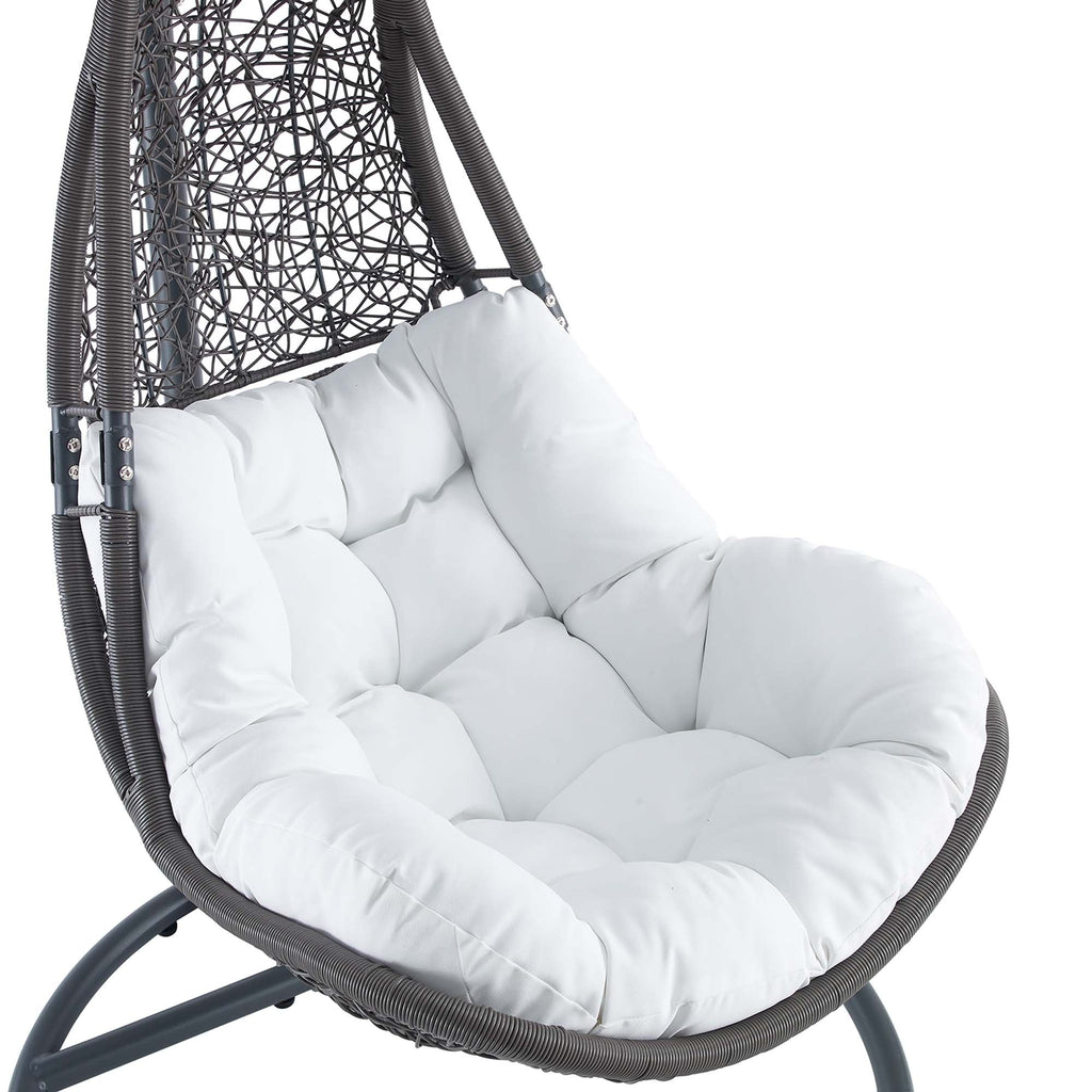 White padded cushion on black woven hanging swing chair seat with armrest supports