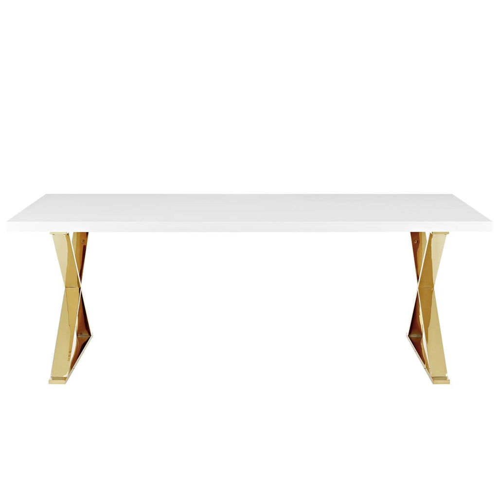 Rectangular dining table with glossy white top and open-frame gold legs