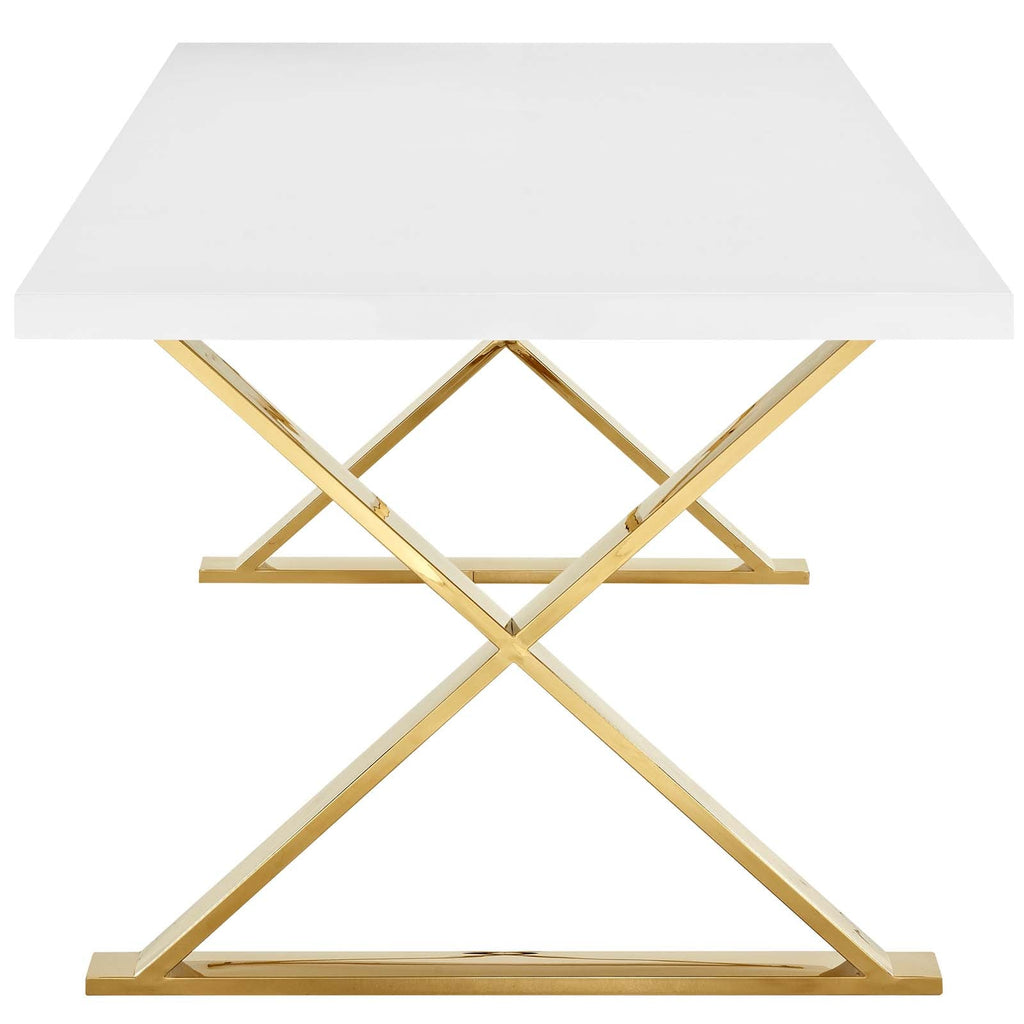 Rectangular dining table with glossy white top and crossed gold pedestal base