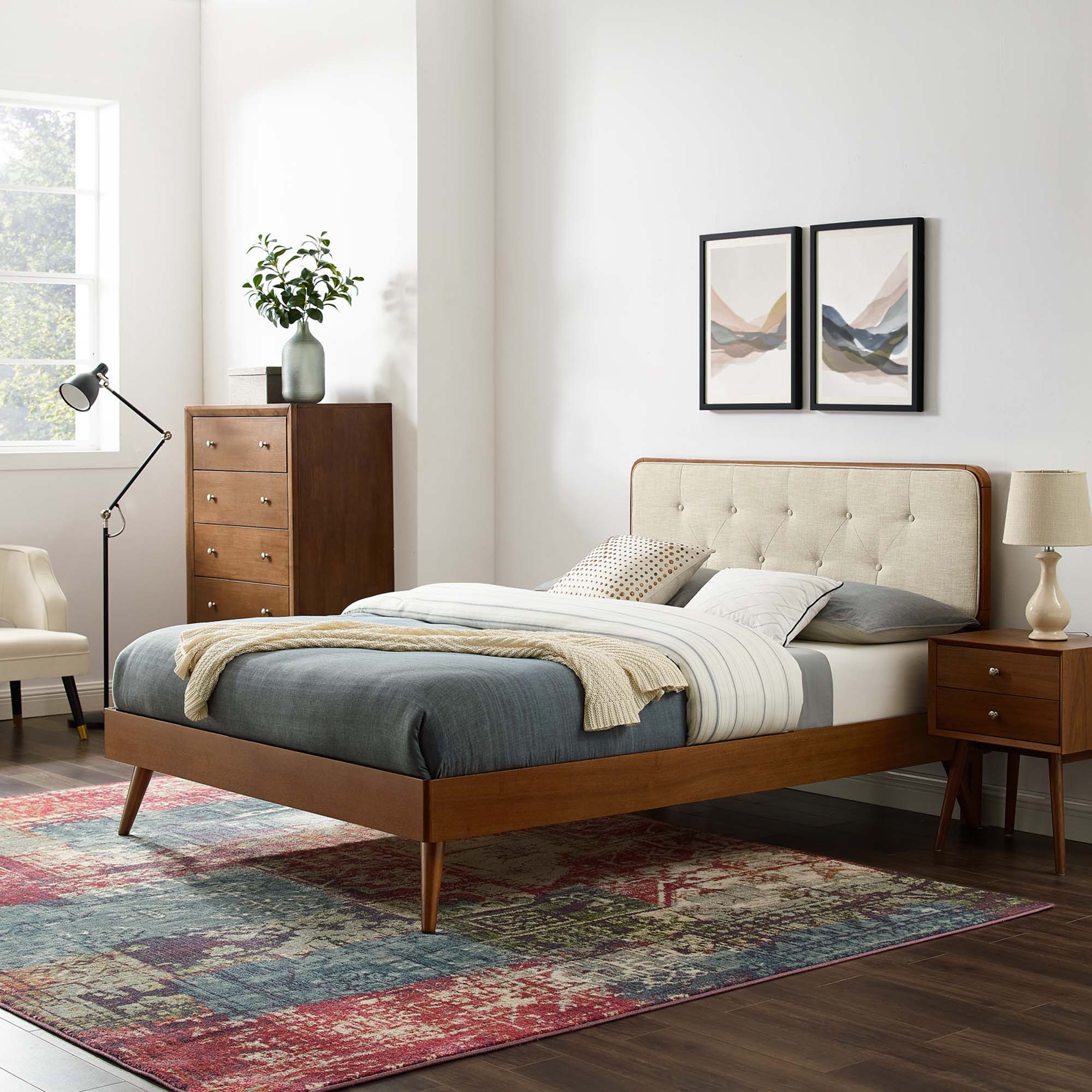 Wood platform bed frame with splayed legs, beige tufted headboard and warm wood frame